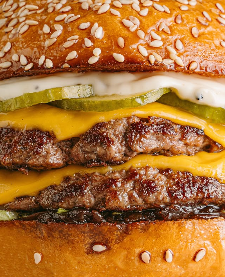 Double smash burger with wagyu patties, cheddar and pickles
