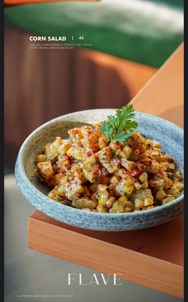 Corn salad bowl on a wooden tray with menu label